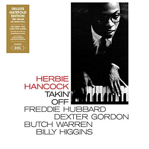 Herbie Hancock’s “Takin’ Off” vinyl album cover featuring a portrait of Hancock at a piano.