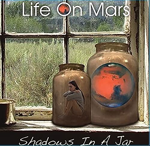 CD cover: woman in a jar with a view of Mars.