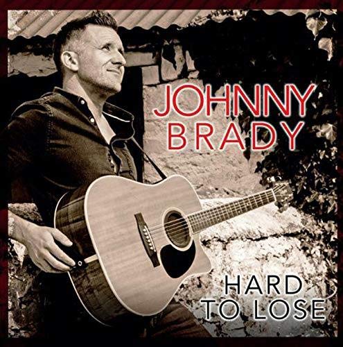 Johnny Brady album cover featuring a man with a guitar.