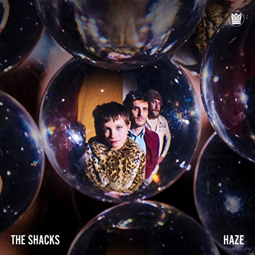 Vinyl record cover for The Shacks’ “Haze” featuring three people in bubbles.