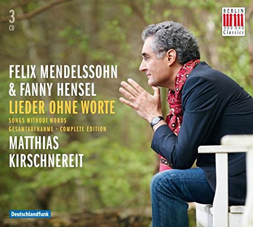 "CD cover with man sitting outdoors, wearing dark jacket and red patterned scarf."