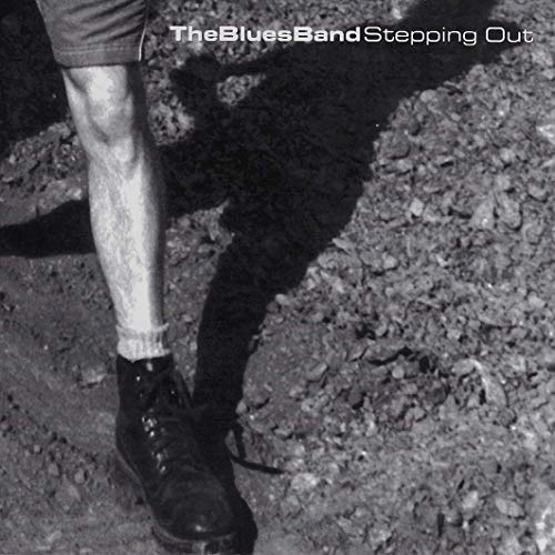 Black and white album cover featuring a person's legs stepping on gravel.