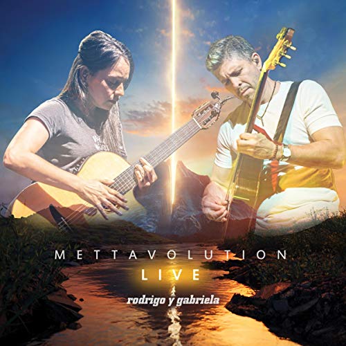The image is a CD cover for "Mettavolution Live" by Rodrigo y Gabriela. Alt text: Two musicians playing guitars outdoors at sunset, with album title and artist name.