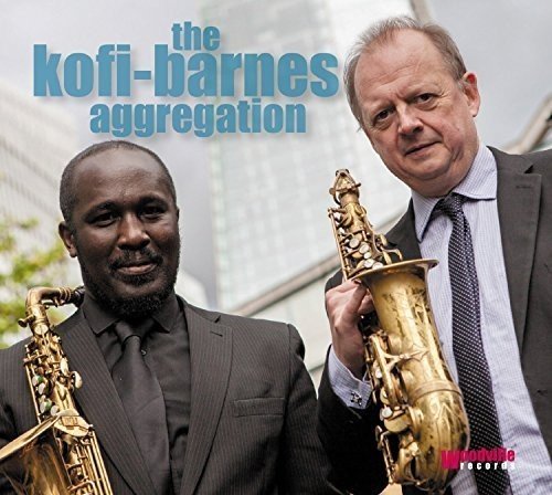 Two men in suits holding saxophones, smiling, with a cityscape in the background.