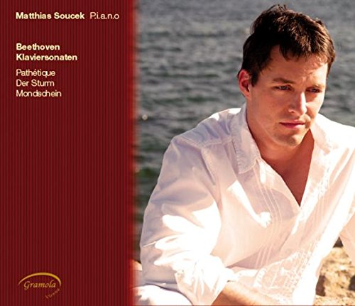 "CD cover with a man in white shirt beside water, red panel with text."