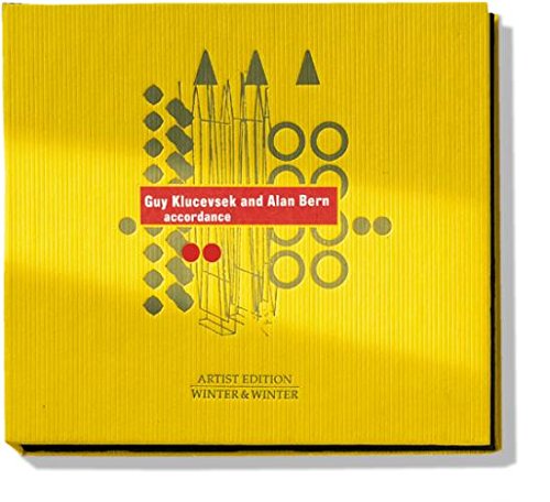 Yellow CD cover with geometric shapes and red label featuring artist names.