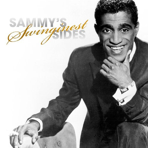Black and white portrait of Sammy Davis Jr. in a suit, smiling.