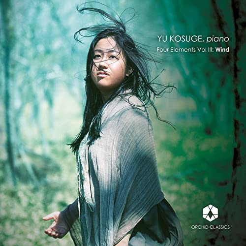 CD cover featuring pianist Yu Kosuge with flowing hair, forest background.