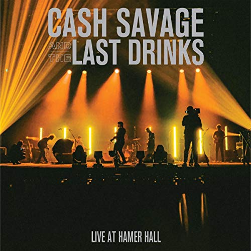 "Album cover featuring a band performing on a stage with bright yellow spotlights."