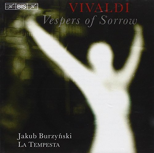 CD cover: dark background with a blurred, white figure raising arms.