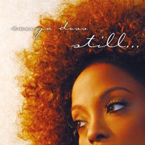 "Album cover with a woman's face and curly hair, titled 'still'."