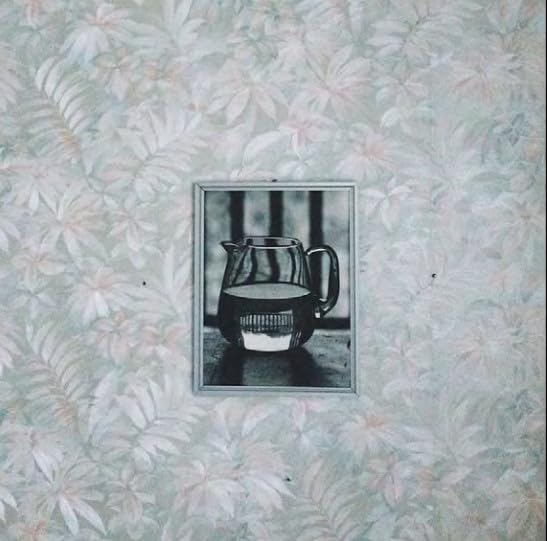 CD cover: framed black and white photo of a glass pitcher.