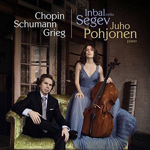 "CD cover featuring a man and woman, with cello, in a rustic room."