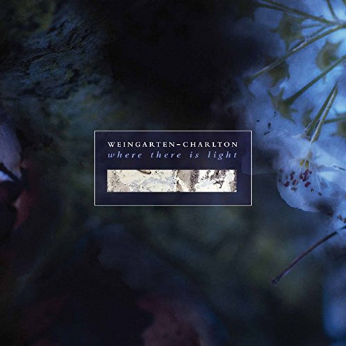 "CD album cover with dark floral background, featuring title and artist name in a box."