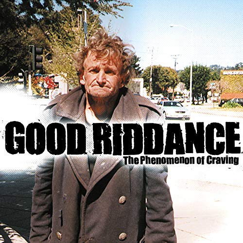 CD cover featuring a man with messy hair in a city street.