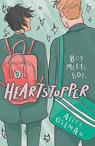 The image depicts the cover of "Heartstopper Volume One". "Illustration of two boys with backpacks, viewed from behind, against a green background."
