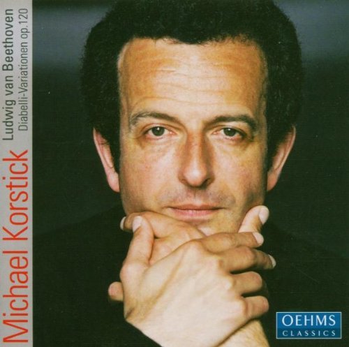 "CD cover with a portrait of man resting chin on hands."