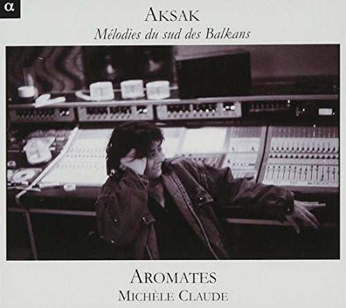 "A CD cover featuring a black and white image of a man at a soundboard."