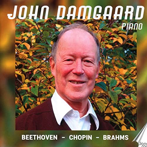 CD cover featuring pianist John Damgaard smiling against foliage.