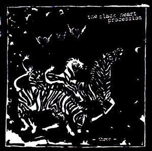 Black and white album cover with striped tigers and floating hearts.