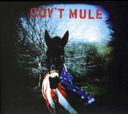"Album cover featuring a mule draped with an American flag, surrounded by trees."