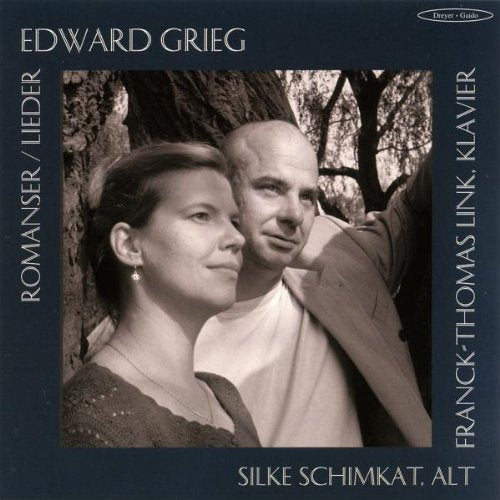 "CD cover with black and white photo of man and woman standing by a tree."