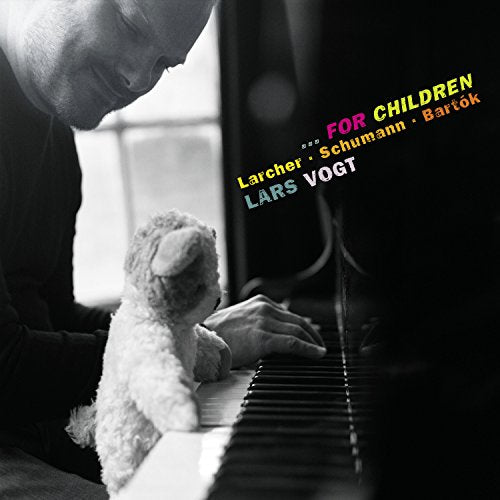 Man playing piano with a teddy bear, colourful text overlay on a dark background.