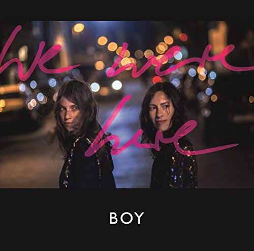 Album cover featuring two women standing on a street at night with blurred city lights.