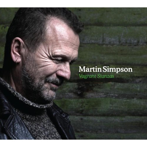 "CD cover with a man in a leather jacket against a wooden background."