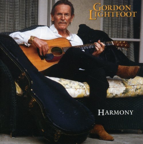 "Gordon Lightfoot album cover featuring the artist sitting on a sofa with an acoustic guitar."