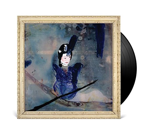 Vinyl record with album cover featuring a framed, abstract portrait.