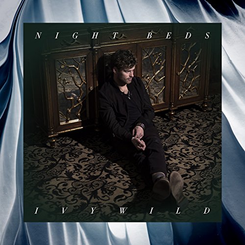 Night Beds album cover, Ivywild, featuring a man seated before a cabinet.