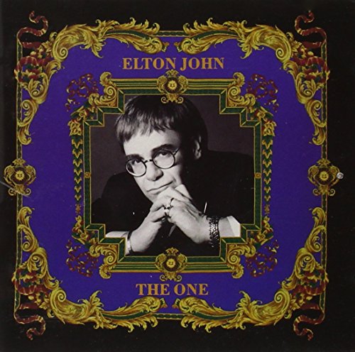 Elton John album cover, "The One," with ornate gold frame and portrait.