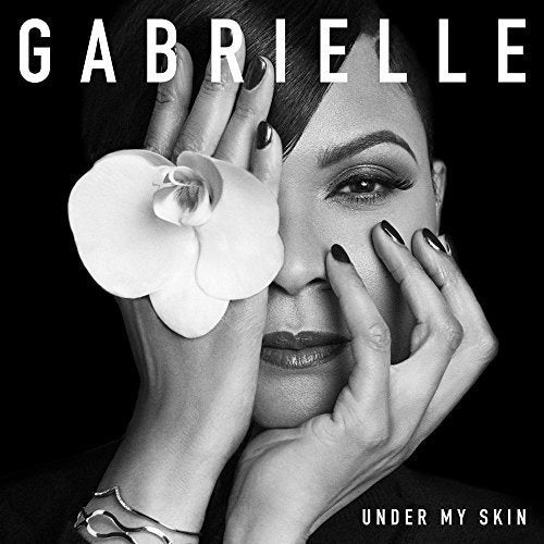 Black and white album cover featuring a woman holding a flower against her face.