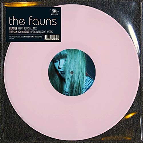 Pale pink vinyl record with a portrait in the center hole.
