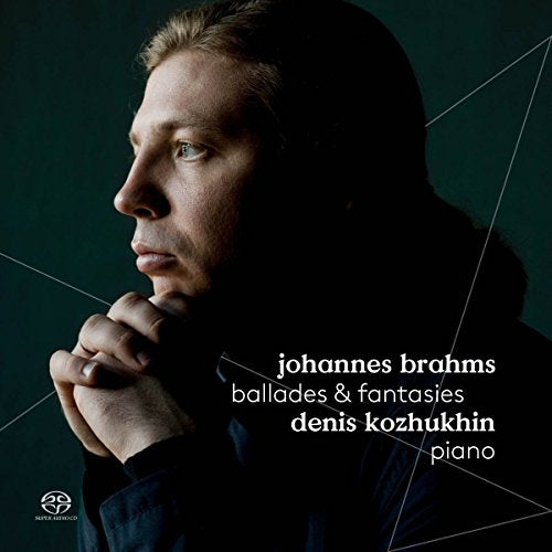 CD cover featuring a man with clasped hands and white text on dark background.