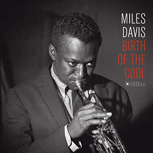 Black and white image of Miles Davis playing trumpet on album cover.