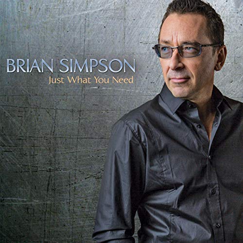 Brian Simpson wearing glasses against a textured gray background on his album cover.