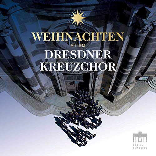 "CD cover featuring a choir in a church with gold and white text."