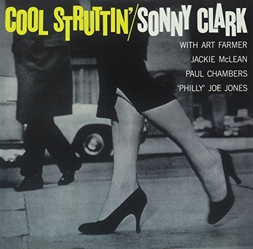 Vinyl album cover featuring a black-and-white image of a woman walking.