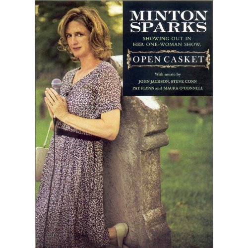 DVD cover featuring a woman holding a microphone, standing beside a tombstone.