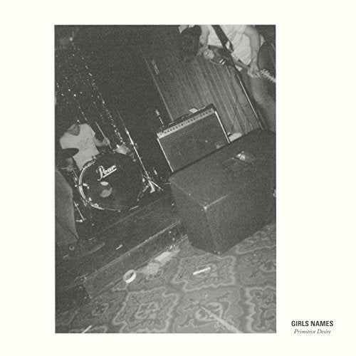 Black and white photo of a band performing live, vinyl record cover.