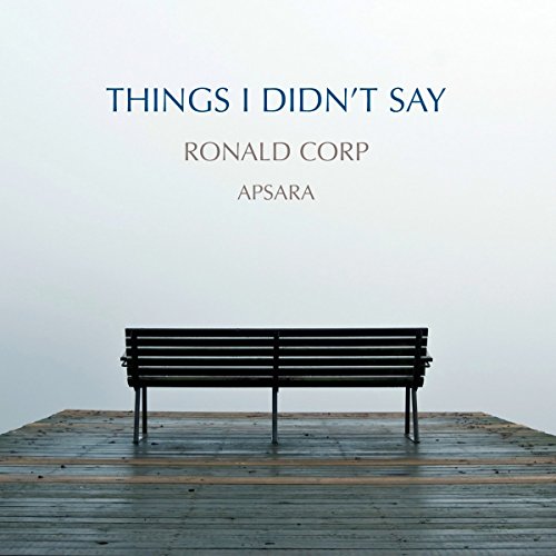 CD cover: empty wooden dock with a black bench, foggy background.