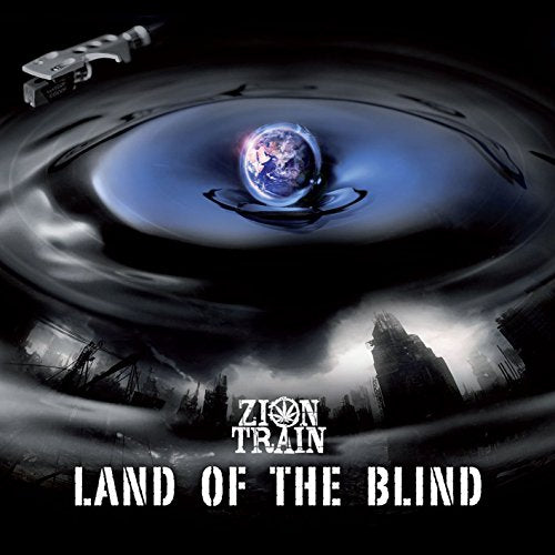"Album cover with a vinyl record, globe, and cityscape, titled 'Land of the Blind'."