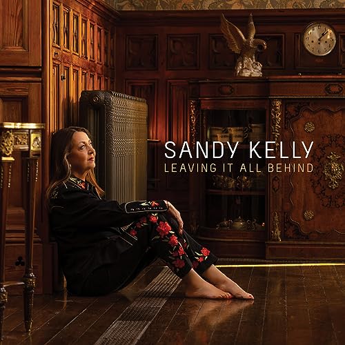 Sandy Kelly album cover: woman seated in a wood-paneled room.