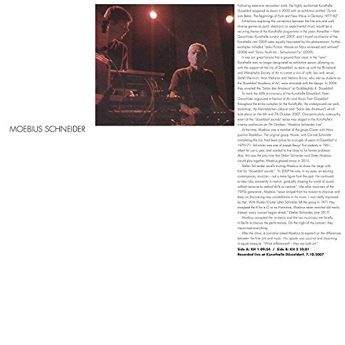 Vinyl record sleeve featuring a photograph of two musicians performing on stage.