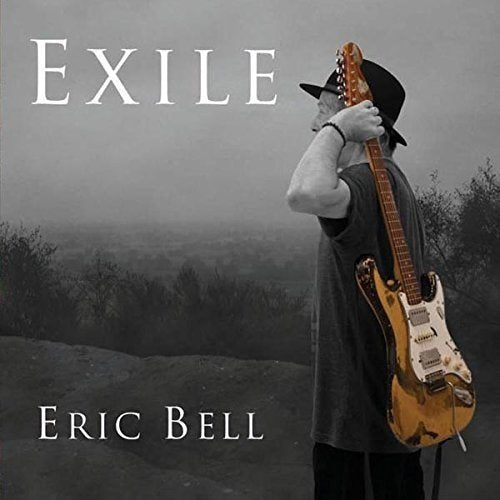 Eric Bell album cover: man with guitar, misty landscape background.