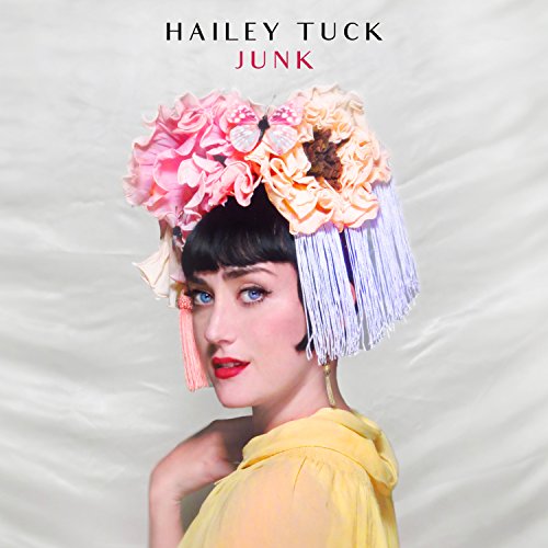 Album cover for Hailey Tuck’s “Junk” featuring a woman with floral headwear.