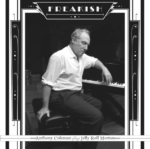 Black and white album cover with man sitting at piano, ornate border.