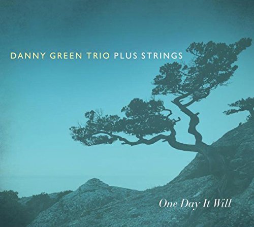 "CD cover with a tree on a rocky hill, blue-toned landscape."